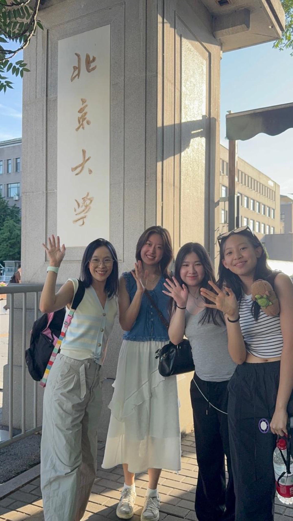 Lynda Lysandra at Peking University main gate, Beijing, with MMC students